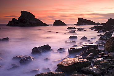 Pink twilight on the rocky shores of Mupe Rocks in winter, Jurassic Coast, UNESCO World Heritage Site, Dorset, England, United Kingdom, Europe