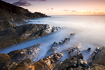 Rocky coast at sunset in winter, Leas Foot Sand, Thurlestone, South Hams, Devon, England, United Kingdom, Europe