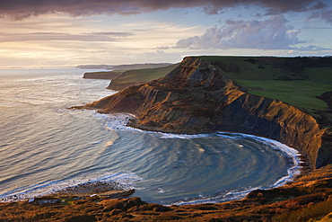 Storm light illuminates Chapmans Pool and Houns Tout cliff, viewed from St. Aldhelm's Head, Jurassic Coast, UNESCO World Heritage Site, Dorset, England, United Kingdom, Europe