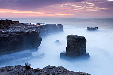 Beautiful sunrise in winter over the rocky coast of Portland Bill on the Jurassic Coast, UNESCO World Heritage Site, Dorset, England, United Kingdom, Europe