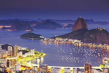 View of Sugar Loaf Mountain (Pao de Acucar) and Botafogo Bay at dusk, Rio de Janeiro, Brazil, South America 