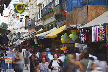 People walking along pedestrianised street of Saara district, Centro, Rio de Janeiro, Brazil, South America 