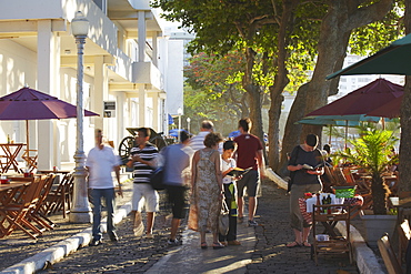 People walking past cafes in the grounds of Forte de Copacabana (Copacabana Fort), Copacabana, Rio de Janeiro, Brazil, South America