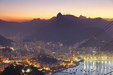 View of Christ the Redeemer statue and Botafogo Bay at sunset from Sugar Loaf Mountain, Rio de Janeiro, Brazil, South America 