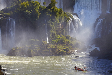 Tourist boat approaching Argentinean side of Iguacu Falls, Iguacu National Park, UNESCO World Heritage Site, Parana, Brazil, South America 