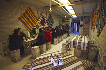 Tourists in salt hotel on Salar de Uyuni (Salt Flats of Uyuni), Potosi Department, Bolivia, South America