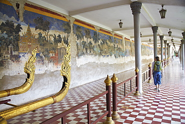 Woman looking at murals at Silver Pagoda in Royal Palace, Phnom Penh, Cambodia, Indochina, Southeast Asia, Asia 