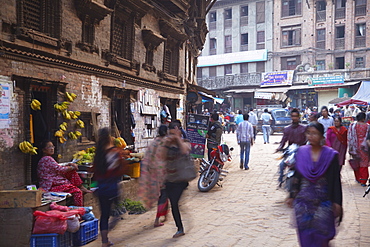 People walking along street, Bhaktapur, UNESCO World Heritage Site, Kathmandu Valley, Nepal, Asia