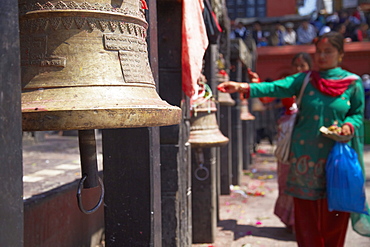 Woman ringing bell, Manakamana Temple, Manakamana, Gorkha District, Gandaki, Nepal, Asia