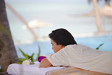 Woman relaxing on massage bed at Melati Beach Resort and Spa, Ko Samui, Thailand, Southeast Asia, Asia