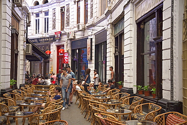 People at cafes in Macca-Villacrosse Passage, Bucharest, Romania, Europe