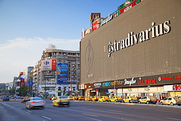 Traffic passing Unirea shopping mall, Bucharest, Romania, Europe