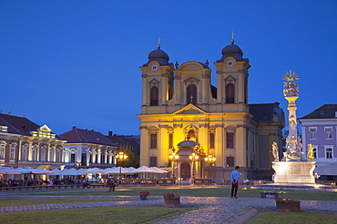 Roman Catholic Cathedral and Trinity Column in Piata Unirii at dusk, Timisoara, Banat, Romania, Europe 