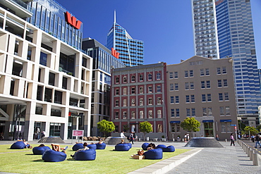 People sitting outside Westpac building in Takutai Square in Britomart precinct, Auckland, North Island, New Zealand, Pacific