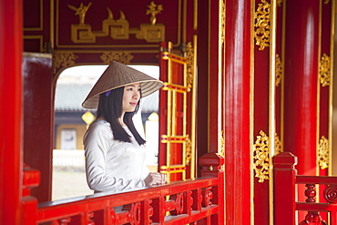 Woman wearing Ao Dai dress in Imperial Palace inside Citadel, Hue, Thua Thien-Hue, Vietnam, Indochina, Southeast Asia, Asia