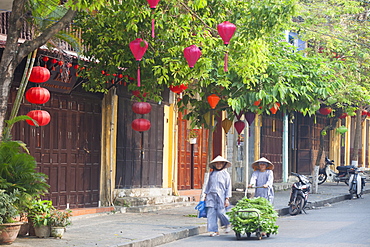 Woman pushing trolley of vegetables along street, Hoi An, UNESCO World Heritage Site, Quang Nam, Vietnam, Indochina, Southeast Asia, Asia