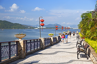 People walking along promenade, Discovery Bay, Lantau, Hong Kong, China, Asia