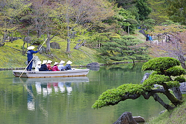 Tourists on boat in Ritsurin-koen, Takamatsu, Shikoku, Japan, Asia