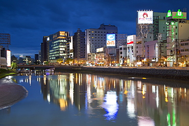 Buildings along Hakata River at dusk, Fukuoka, Kyushu, Japan, Asia