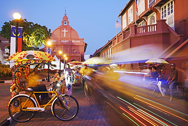 Trishaws passing in Town Square, Melaka, Malaysia, Southeast Asia, Asia