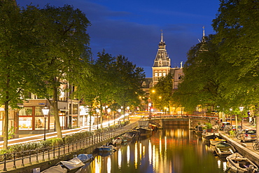 Spiegelgracht canal and Rijksmuseum at dusk, Amsterdam, Netherlands, Europe