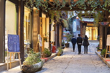 People walking through street, Lijiang, UNESCO World Heritage Site, Yunnan, China, Asia