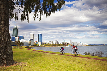 People cycling alongside Swan River, Perth, Western Australia, Australia, Pacific