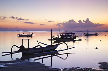 Boats on Sanur beach at dawn, Bali, Indonesia, Southeast Asia, Asia