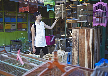 Woman at bird market, Yogyakarta, Java, Indonesia, Southeast Asia, Asia