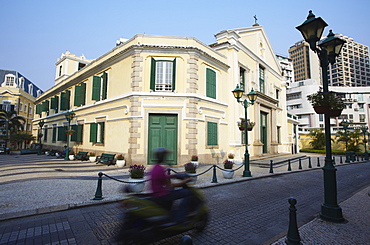 Motorbike passing St. Augustine's Church, Macau, China, Asia