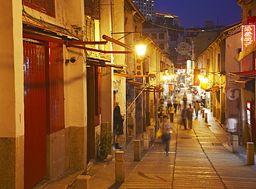 People walking along Rua da Felicidade at dusk, Macau, China, Asia