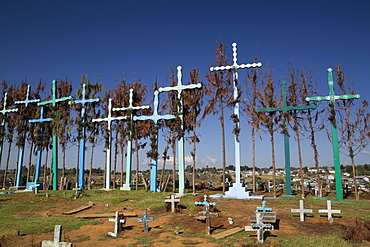 A series of tall crosses at the crest of the graveyard, boards represent doors to and from the grave, village of El Romerillo, Chiapas, Mexico, North America 