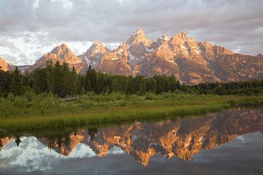 Water reflections of the Teton Range, taken from the end of Schwabacker Road, Grand Teton National Park, Wyoming, United States of America, North America