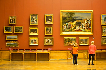 Tourist viewing 19th century Russian paintings, Russian Museum, UNESCO World Heritage Site, St. Petersburg, Russia, Europe