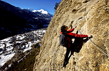 Climbing a via ferrata course near Vallouise, Ecrins Massif, France, Europe