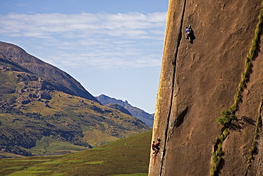 Two rock climbers making their way up a very difficult route on the 450 metre monolith of Karimbony, Tsaranoro Massif, Andringitra National Park, Southern Madagascar, Africa