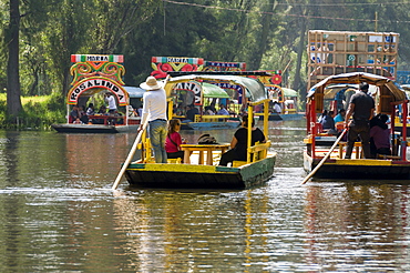 Colourful boats at the Floating Gardens in Xochimilco, UNESCO World Heritage Site, Mexico City, Mexico, North America 