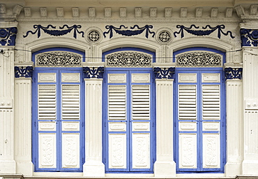 Close-up of traditional old houses with shuttered windows and decorative mouldings in Little India, Singapore, Southeast Asia, Asia