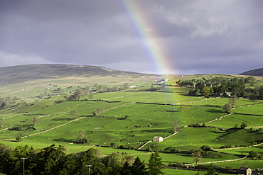 A rainbow over the countryside of Swaledale, Yorkshire Dales, Yorkshire, United Kingdom, Europe