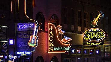 Neon signs and historic music clubs along Lower Broadway in Nashville, Tennessee, United States of America, North America