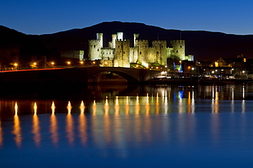 Conwy Castle and town at dusk, Conwy, Wales, United Kingdom, Europe