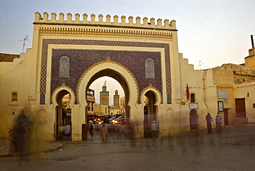 Blurred people passing through the Blue Gate, Fez, Morocco, North Africa, Africa