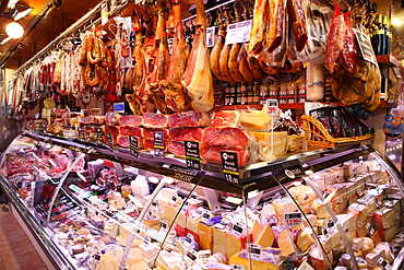 Hams hanging in market, Barcelona, Catalonia, Spain, Europe