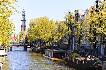 Westerkerk church tower by Prinsengracht canal, Amsterdam, Netherlands, Europe