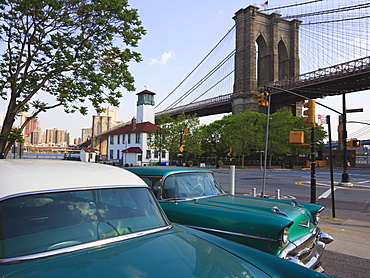 Two 1950's cars parked near the Brooklyn Bridge at Fulton Ferry Landing, Brooklyn, New York City, New York, United States of America, North America