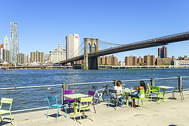 People enjoying the view of Brooklyn Bridge and the East River from Brooklyn Bridge Park, Brooklyn, New York City, New York, United States of America, North America