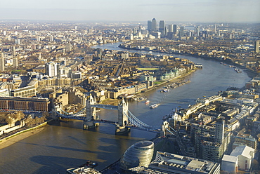 Elevated view of the River Thames looking East towards Canary Wharf with Tower Bridge in the foreground, London, England, United Kingdom, Europe