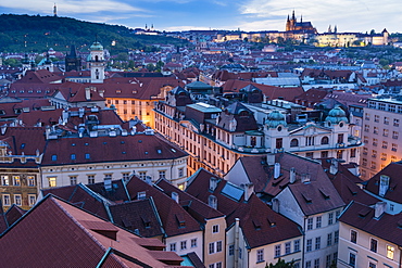 View over the Old Town rooftops towards St. Vitus's Cathedral at dusk, UNESCO World Heritage Site, Prague, Czech Republic, Europe