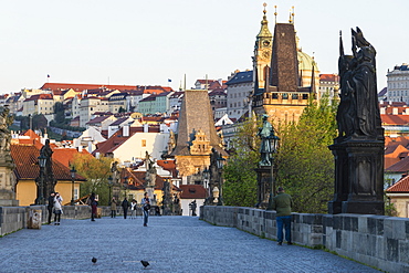 Early morning on Charles Bridge looking towards Prague Castle and Hradcany, UNESCO World Heritage Site, Prague, Czech Republic, Europe