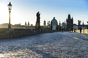 Early morning on Charles Bridge looking towards the Old Town, UNESCO World Heritage Site, Prague, Czech Republic, Europe